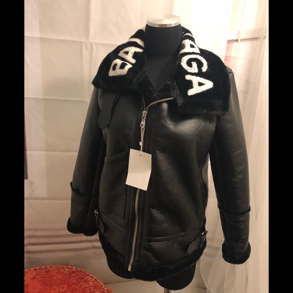 MEDIUM NWT Blk Faux Leather/faux shearling lining.